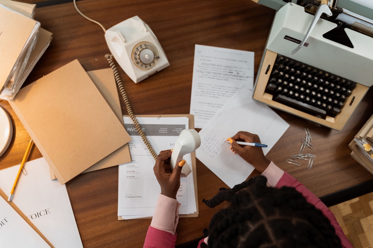 Accountant and director reviewing a year-end plan on how to minimise corporation tax for a UK limited company